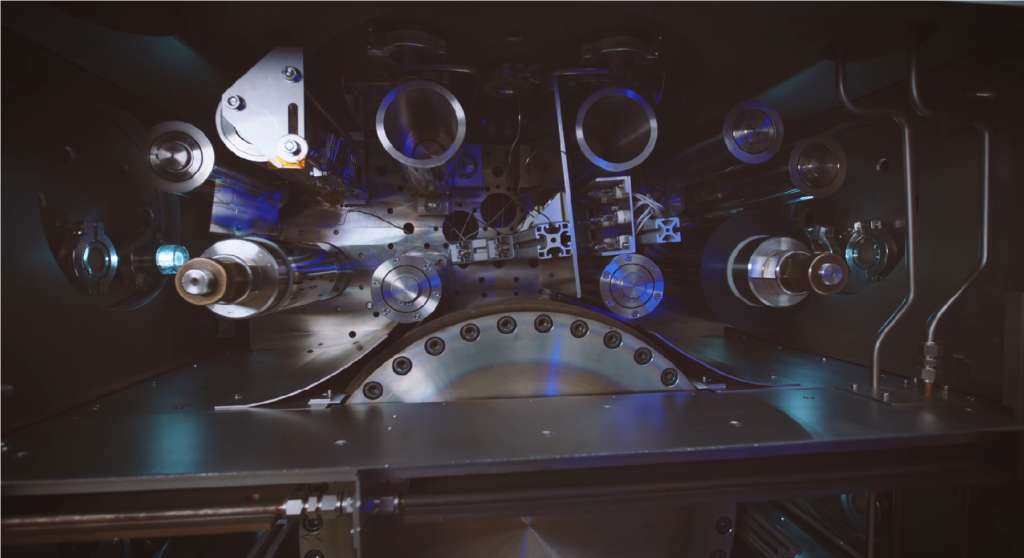 Interior chamber of a sputtering system, used to deposit thin layers of functional materials onto substrates like plastic film.