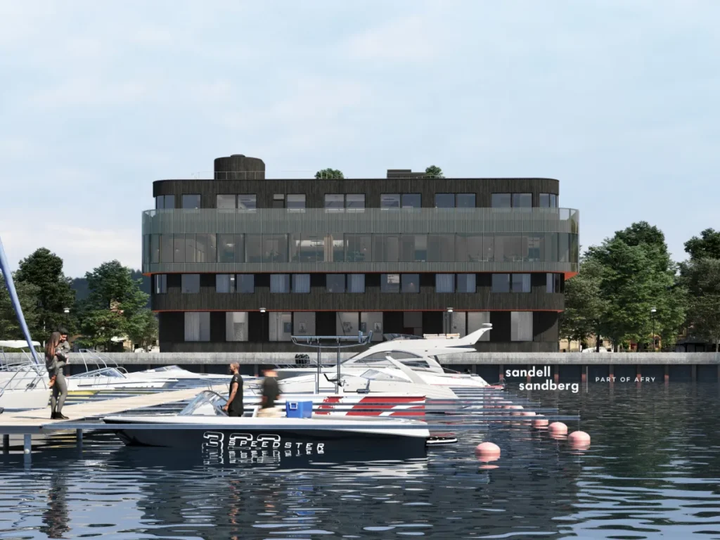 Rendering of a modern, dark-colored office building with large windows and rounded corners, situated by a marina with several boats docked in calm water.